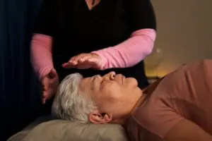 Woman receiving energy therapy
